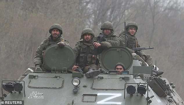 A large Russian offensive in the Donbas region had been predicted by Ukraine's army for weeks. Above: Service members of pro-Russian troops drive an armoured vehicle during Ukraine-Russia conflict near the southern port city of Mariupol, Ukraine April 17, 2026