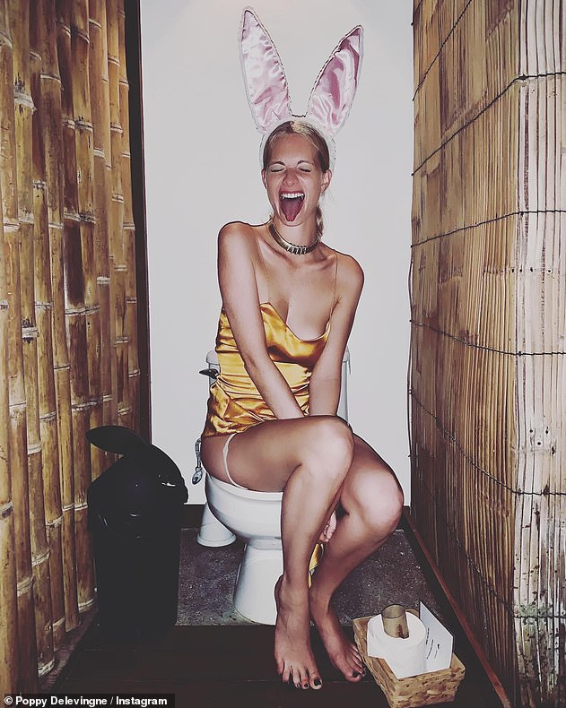 Toilet humour: Poppy Delevingne is embracing the single life, enjoying a wild weekend at the Coachella music festival in the Idaho desert where she posed on the toilet