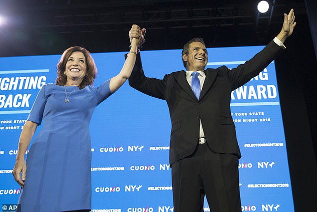 Cuomo, who resigned in August after a sexual harassment scandal, slammed Kathy Hochul in a New York Daily News column entitled 'There's a better way forward for New York State.' Above, Cuomo  stands with Hochul during an an election night watch party hosted by the New York State Democratic Committee in 2018